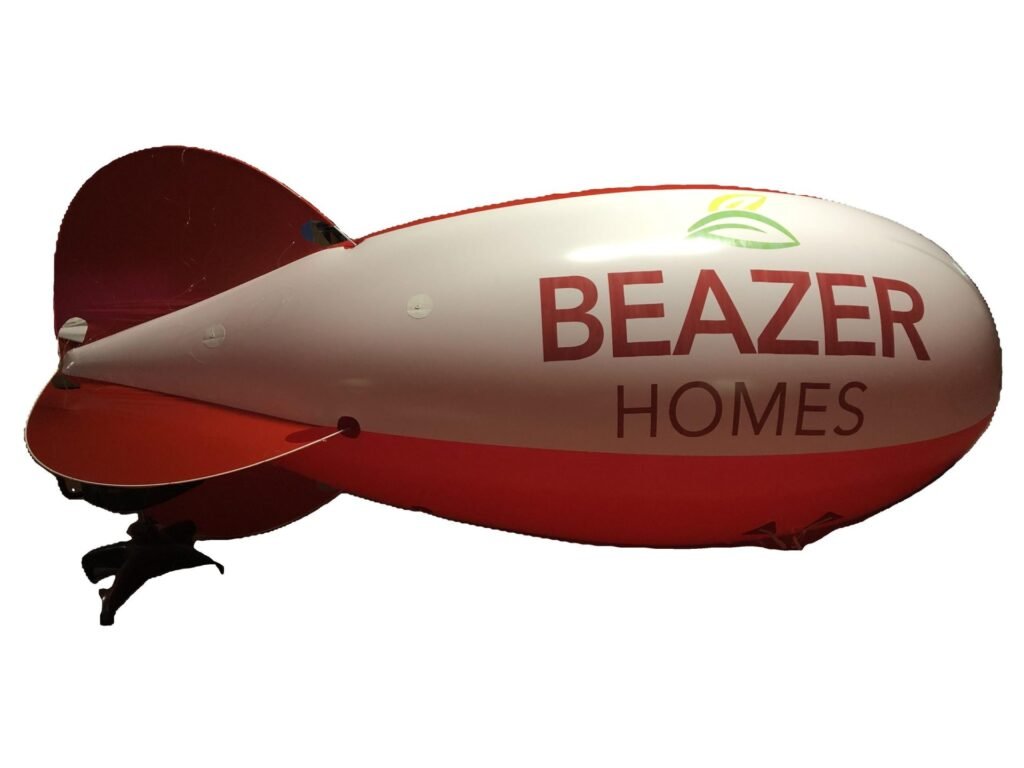 13 ft red and white helium advertising blimp printed with a home builder logo